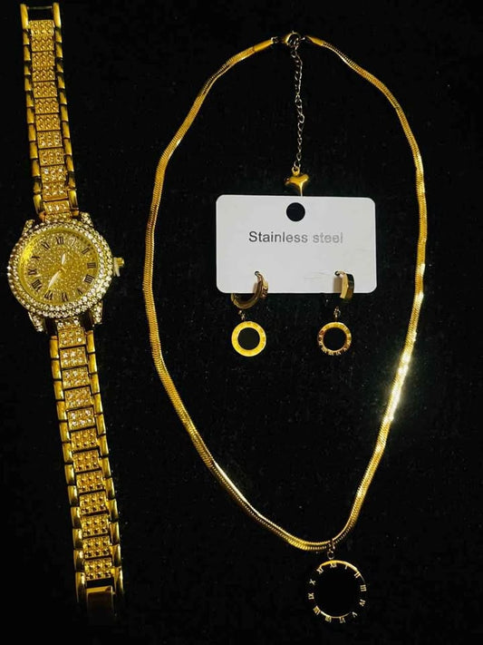 Conjunto de joyería incluye reloj, cadena con dije y par de aretes con detalle en color negro, acero inoxidable