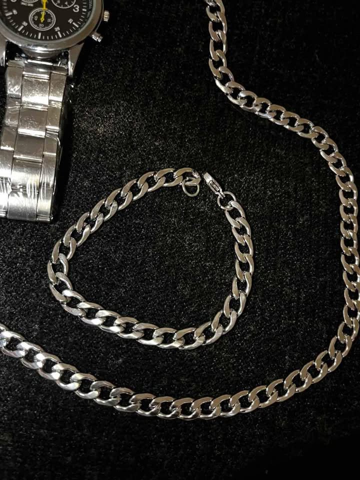 Conjunto de joyería de acero inoxidable incluye reloj carátula negra, cadena de 5 mm por 60 cm de largo, esclava de 20 cm de ancho