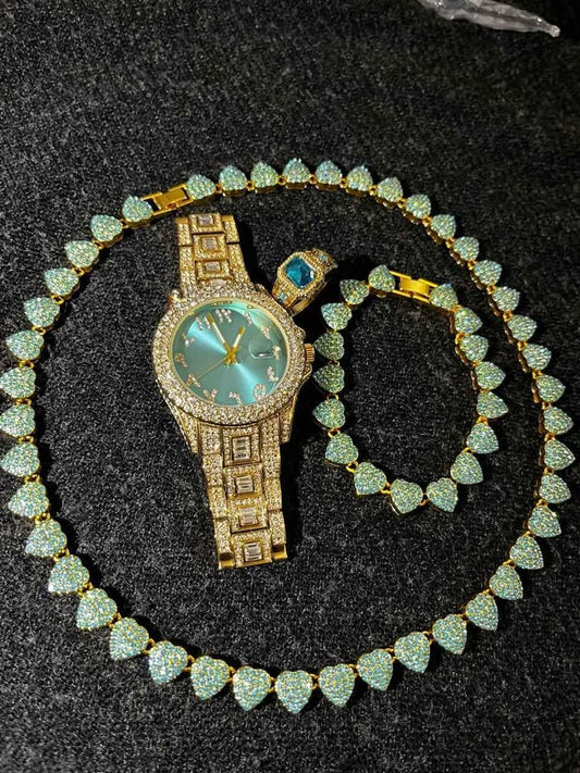 Conjunto de joyería dorada con detalle en color verde azul